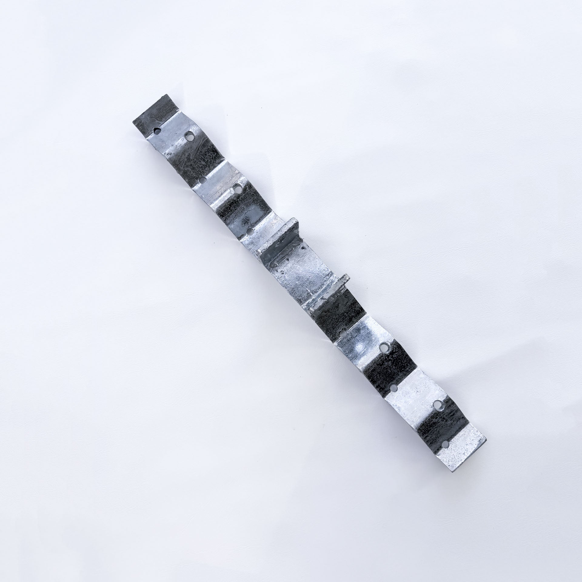 Angled view of galvanised roof bracket showing the raised post and corrugated shaping