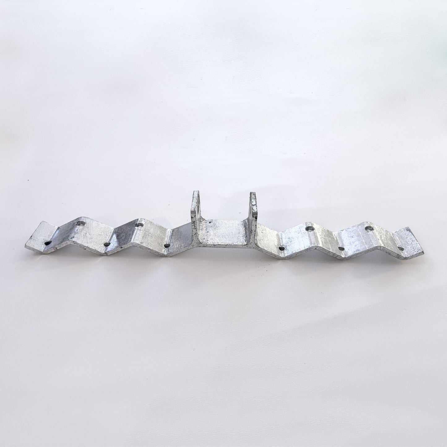 Galvanised corrugated roof bracket with raised post for a shade sail fixing point