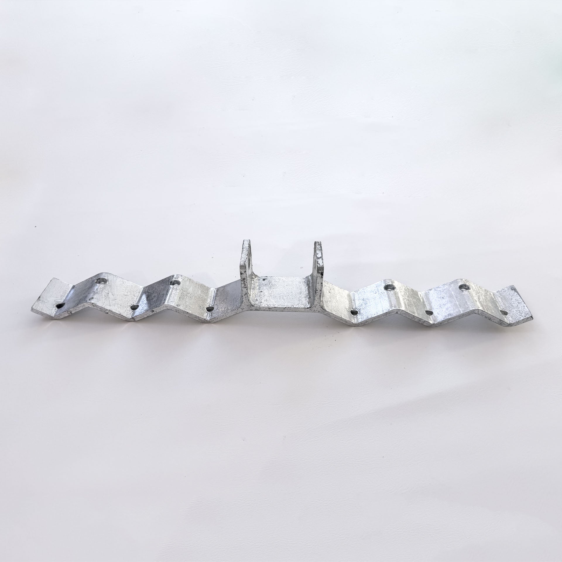 Galvanised corrugated roof bracket with raised post for a shade sail fixing point